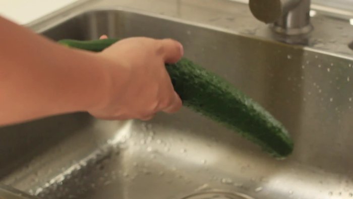 Gently smash the cucumber with the side of a knife or a rolling pin. Don't completely pulverize it; you want it slightly smashed, not broken into pieces.