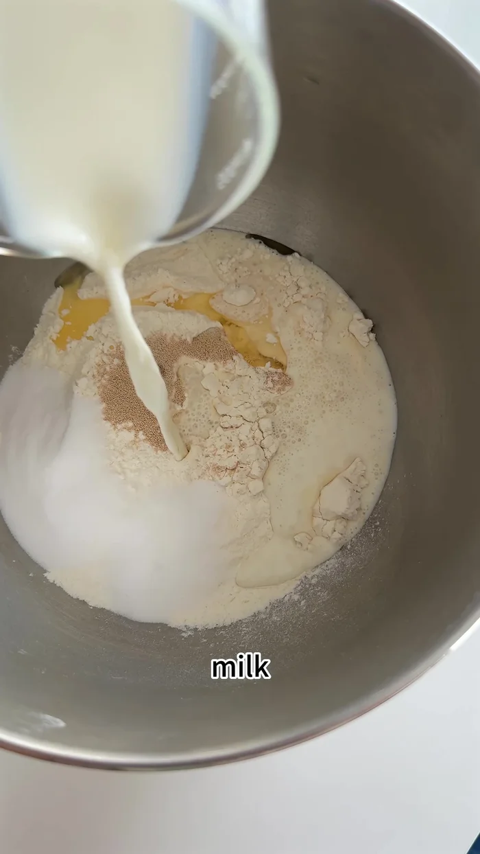Prepare the custard filling: Whisk together custard powder, milk, sugar, butter, and egg yolks. Cook over low heat until thickened.