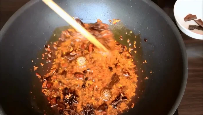 Add soy sauce, rice vinegar, and sugar to the sauce. Stir well. (This step is inferred, details are missing from the transcript)