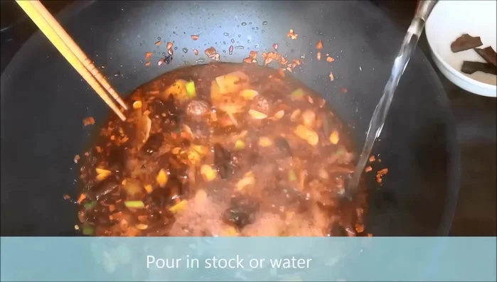 Add water and bring the sauce to a boil. (This step is inferred, details are missing from the transcript)
