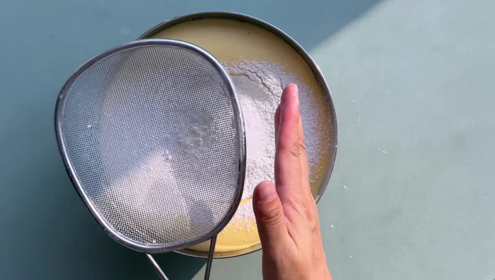 Bake the cake until golden brown and cooked through.