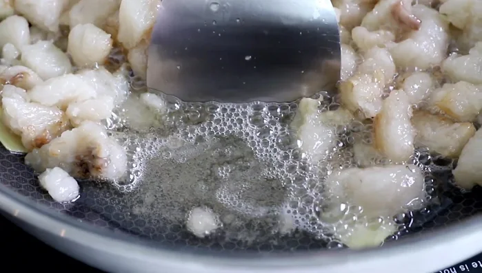 Finish rendering the lard. Transfer the rendered lard into a suitable container.