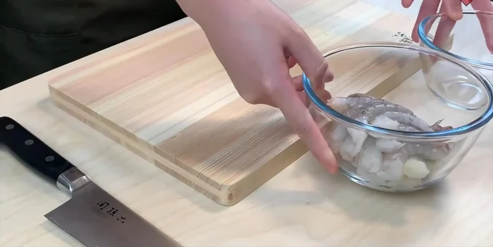 Knead the dough until smooth and elastic. (Implied by music and audio)