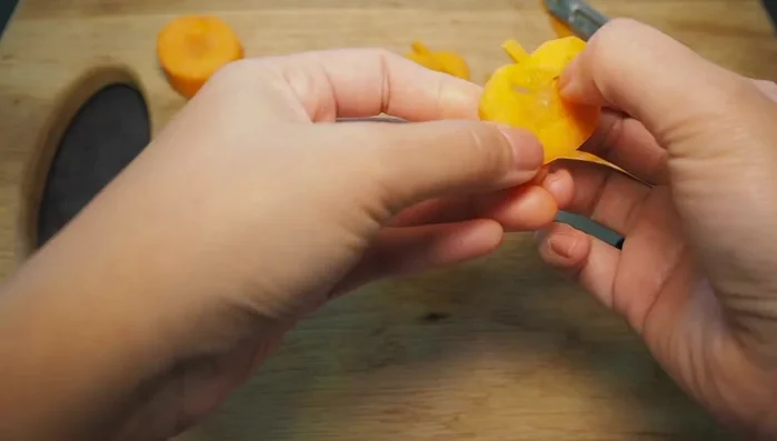 Arrange the finished carrot pumpkins on a serving plate.