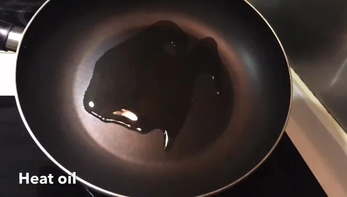 Add more oil to the wok if necessary, then add garlic and ginger. Stir-fry briefly until fragrant.