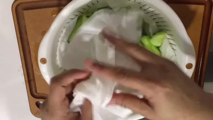 Add sliced cucumber and stir-fry for a few minutes until slightly softened but still crisp.