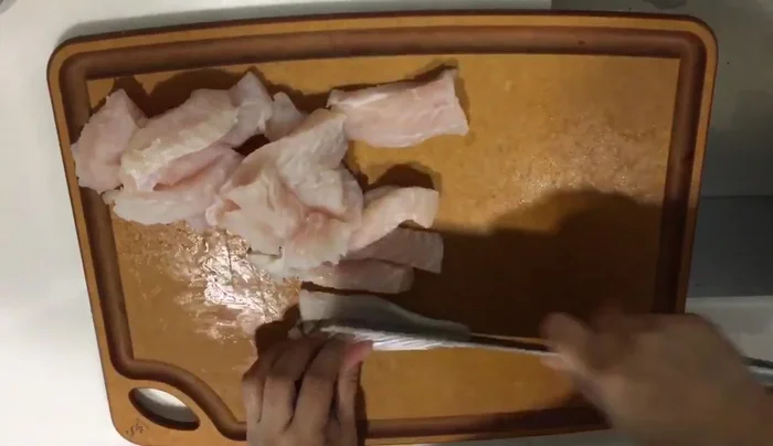 Place the seasoned fish fillets in the air fryer basket ensuring they aren't overcrowded.
