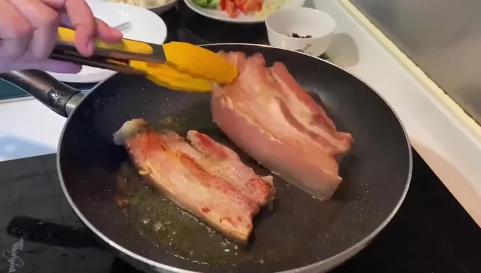 Stir-fry the pork belly until browned.
