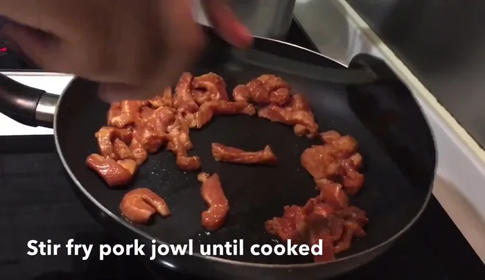 Enjoy your delicious Pork Jowl in Soy Bean Sauce! (Details missing from transcript)