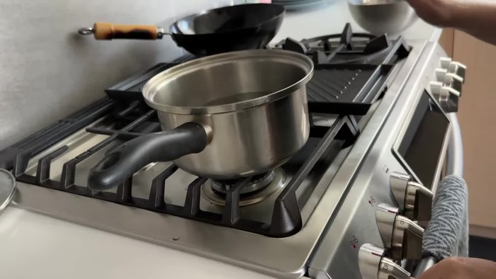 Boil enough water to cover the chicken. Add chicken thighs (or breast) and simmer for 20 minutes after boiling. Turn off heat and let it sit for another 10 minutes.