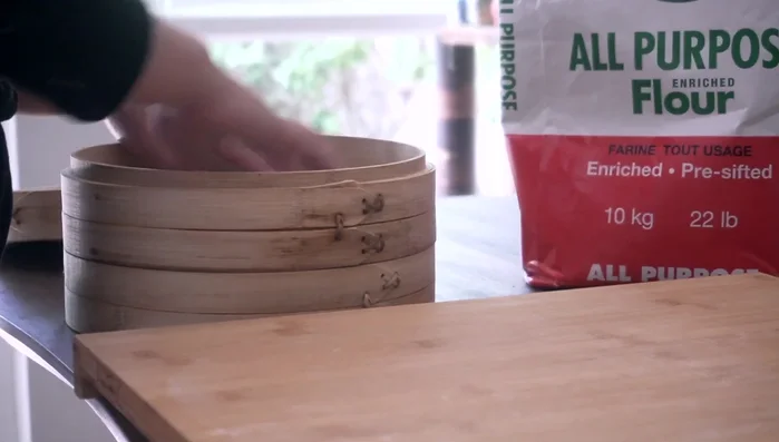 Set up a bamboo steamer, lining it with steamer paper or parchment paper.