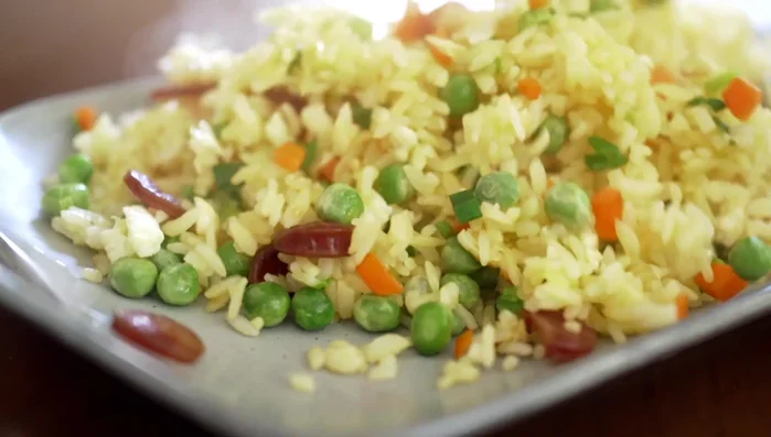 Season: Once the rice is cooked through and separated, season with cooking alcohol, soy sauce, and salt to taste.