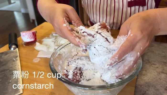 Coat pork chops with cornstarch, letting it absorb for a minute or two.
