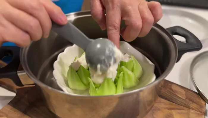 Place the fish paste ball on top of the prepared bok choy. Add a few Goji berries for garnish.
