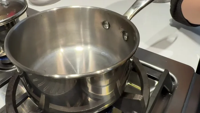 Heat oil in a small pan until smoking hot.