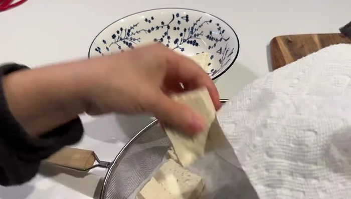 Lay the tofu at the bottom of a large bowl. Place the fish steaks on top.