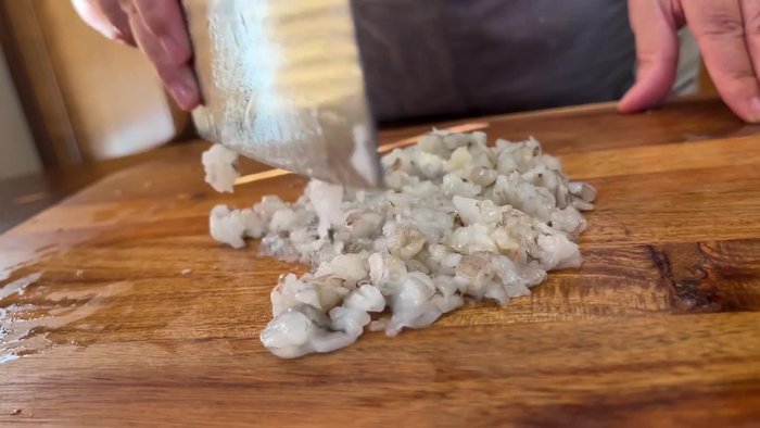 Butterfly and mince the shrimps until paste-like.