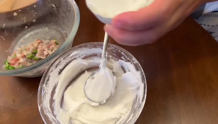 Add a small amount of filling, then cover with more paste and smooth with a spoon.