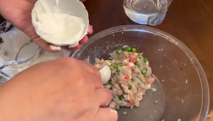 Repeat until all dumplings are assembled.