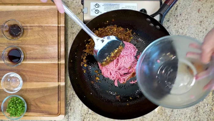 Add ground pork, breaking up chunks. Cook until no pink remains.