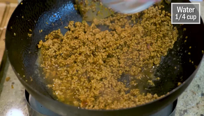 Add water and let it simmer briefly. Set aside.