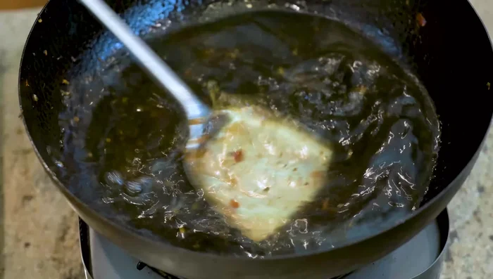 In the same wok, bring 5-6 cups of water (or stock) to a boil.