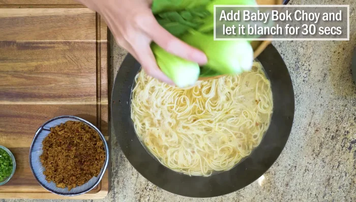 Add baby bok choy and blanch for 30 seconds.