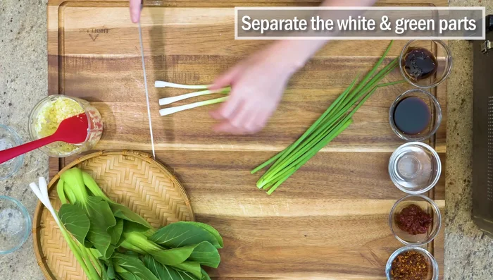Dice scallions, separating white and green parts. Use white parts for stir-fry, reserve green for garnish.