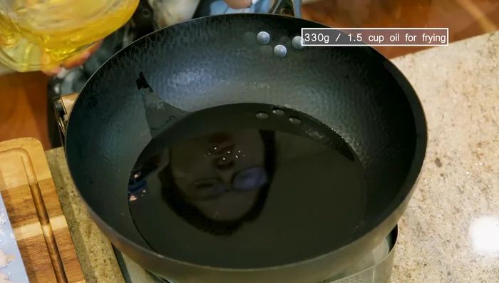 Heat oil in a wok to 380°F. Fry chicken in batches until crispy, about 3-4 minutes per batch.