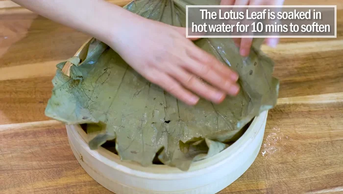 Steam again for 20 minutes, placing rice on a lotus leaf (or substitute) in the steamer, poking holes for steam circulation.