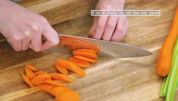 Cut carrots and celery into bite-sized pieces. Prepare baby bok choy.