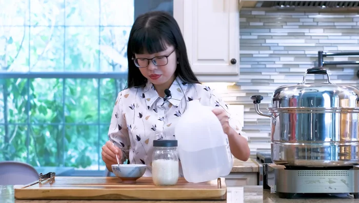 Dissolve distiller's yeast with distilled (or boiled and cooled) water in the sanitized bowl.