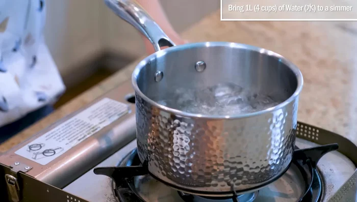 For Poached Eggs with Sweet Rice Wine Soup: Bring four cups of water to a simmer, then turn off the heat. Crack eggs and poach to desired doneness (2 minutes for soft yolk).