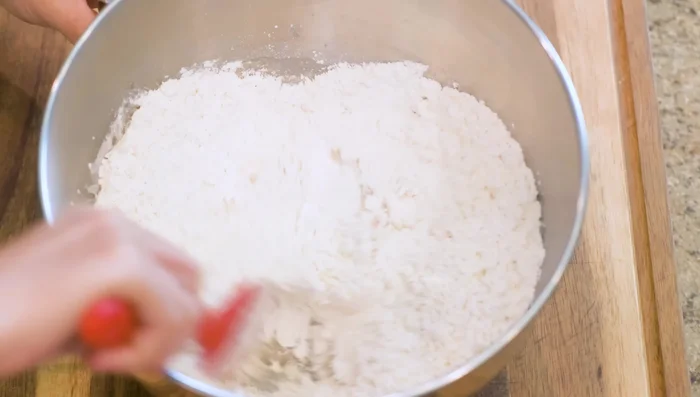 Add flour to the yeast mixture and knead using a KitchenAid mixer (or by hand) for 10 minutes until smooth.