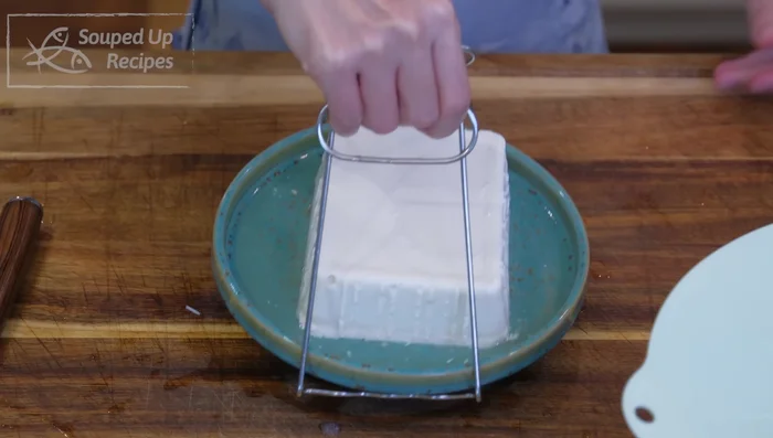 Steam silken tofu for 10 minutes.
