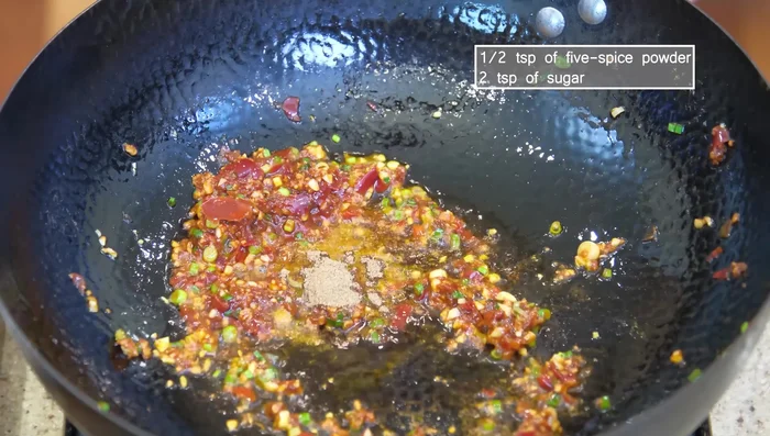 Add five-spice powder, sugar, chili powder, and the remaining citron peppercorns. Stir.