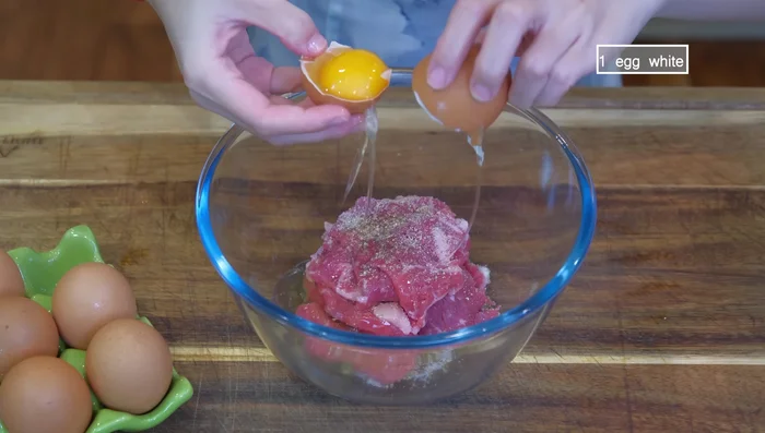 Marinate beef with salt, white pepper, and egg white for a few minutes.