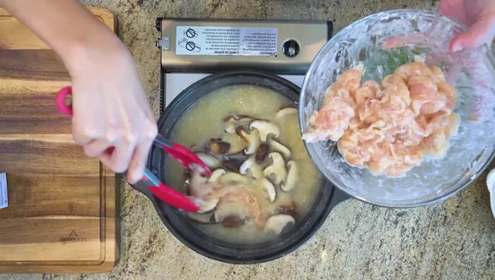 Add the marinated chicken and stir until the color changes. Turn off heat.