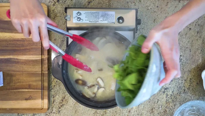 Add baby bok choy and stir quickly, letting residual heat cook the vegetables.
