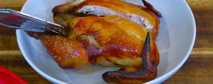 Serve: Cut the hen open and serve with rice, vegetables, and the gravy.