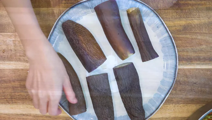 While eggplants cool, make the garlic sauce: Blend 10 cloves of garlic using a cordless blender.