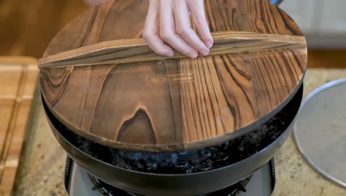 Bring a pot of water to a boil. Add 2-3 tablespoons of white vinegar.