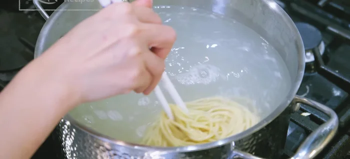 Remove noodles from boiling water and shake off excess water.
