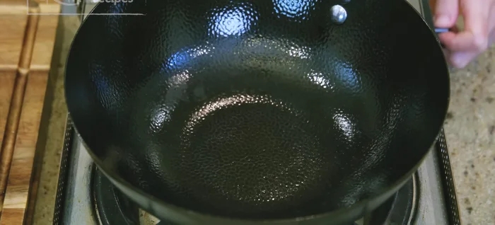 Heat a wok over medium heat until smoking hot.