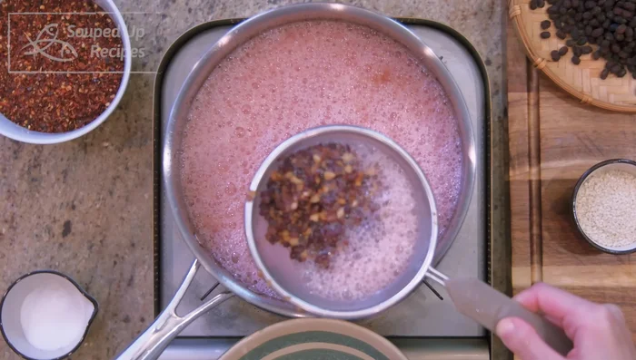 Remove the beef and garlic from the pot, leaving the oil. Increase heat to high and bring the oil temperature to 400°F.