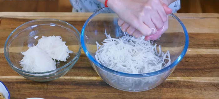 Squeeze out excess moisture from the salted radish.