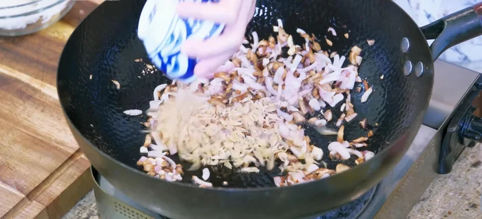 Add sun-dried baby shrimp (or dried shrimp) and pork lard. Stir for a few minutes.