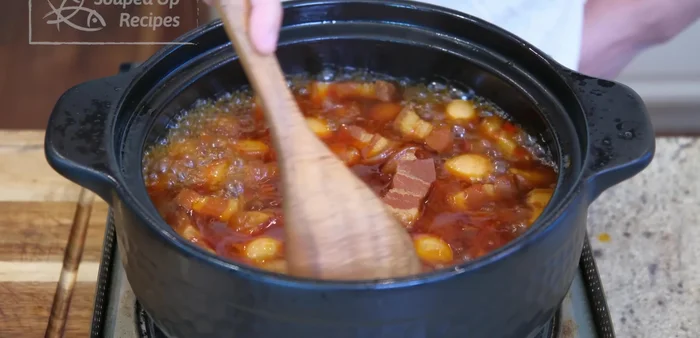 Reduce sauce: Discard ginger and scallions. Turn heat high, constantly stir to reduce the sauce to a glossy glaze.