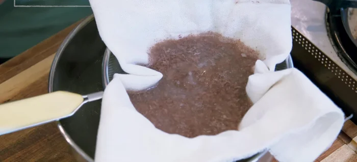 Strain the blanching water through cheesecloth to reserve the broth.