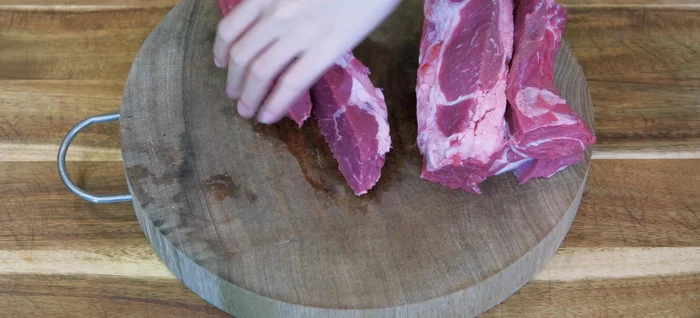 Cut beef into 1-inch cubes. Add to a stock pot with 2L of water and beef neck bones.